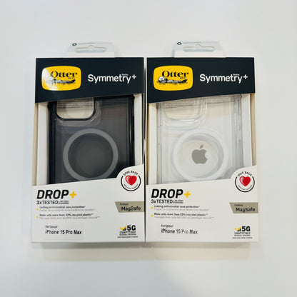 Two Symmetry+ phone case packages for iPhone 15 Pro Max on a white background